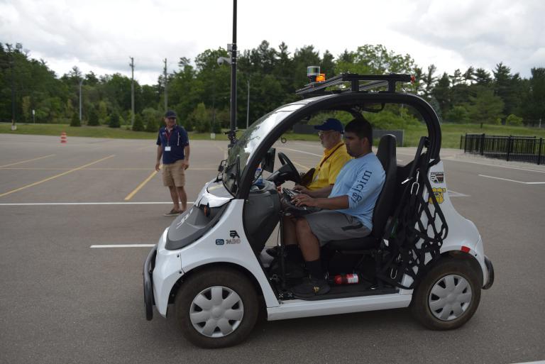 Students test Kettering's intelligent ground vehicle during a competition.